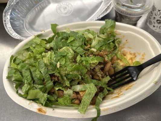 Chicken Bowl with guacamole, pinto beans, lettuce, and veggies