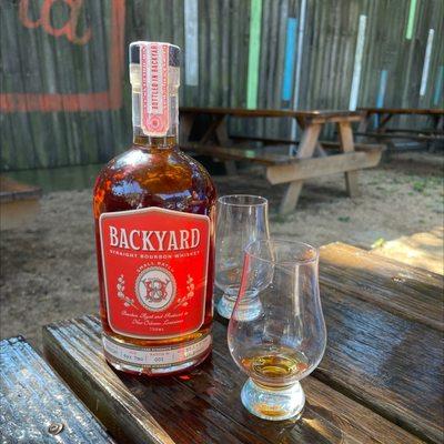 Backyard's own bourbon for sale by the glass or bottle l