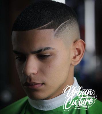 Men's haircut fade with edge up.