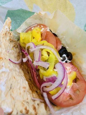 Salami, pepperoni, tomato, banana peppers, and black olive with mayo.  Yes, it's unusual....but don't knock it til you try it