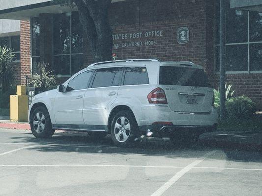 Thank you for parking directly in front of the post office at a red zone, blocking traffic flow.