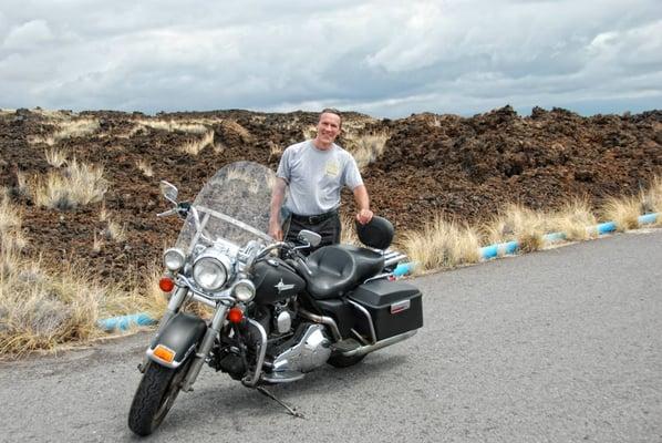 My husband posing with our Harley rental at an old lava flow in Kona, HI