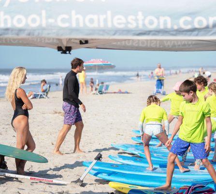 Summer campers warming up before a fun day of surfing!