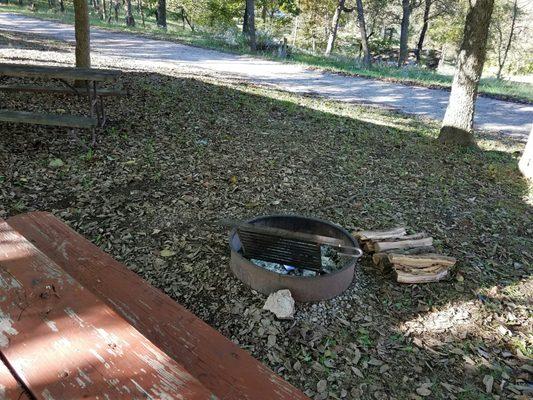 Campfire ring beside each cabin