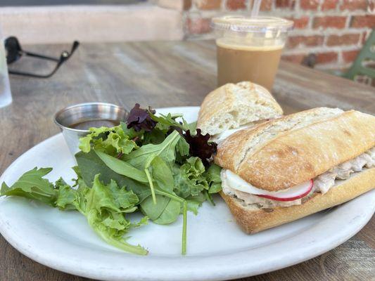 Tuna panino, salad with dressing on the side, and an iced espresso with almond syrup and a splash of soy milk.