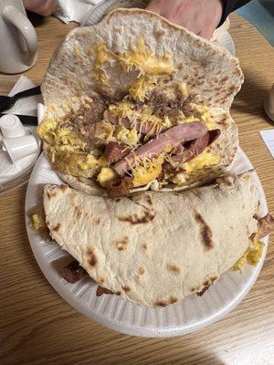 Teran's taco   Ham , bacon , cheese , beans , potato and egg .