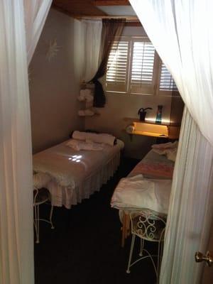 Inside the left room: 2 massage tables for couples massage, nice music playing, and a tranquil ambiance