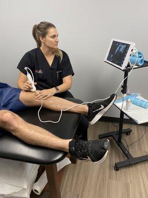 Madeline Lummis, PA-C performing an ultrasound guided cortisone injection.