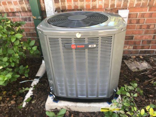 Trane XR14 Condensing unit on Cladlite Hurricane-rated concrete pad