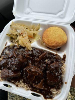 Oxtails with rice, cabbage & cornbread