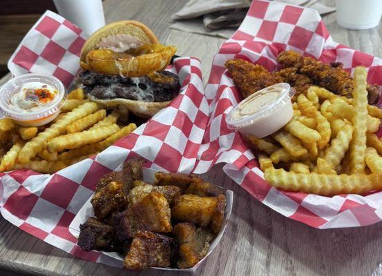 Queso burger, chicken tenders, Phuket fries, and Adobo Cracklins