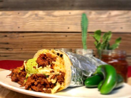 Hungry? Try Don Ramon's remedy: burritos! Pictured here with carne al pastor (marinated pork).