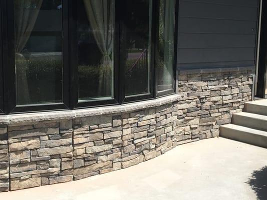 Charcoal Gray Steel Siding and cultured stone