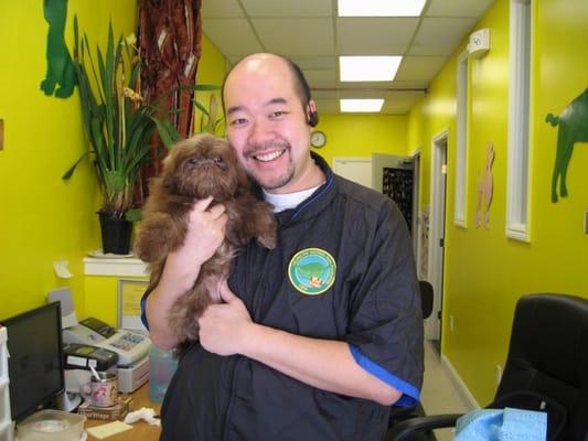 Everyone is smiling when an adorable puppy is clean.