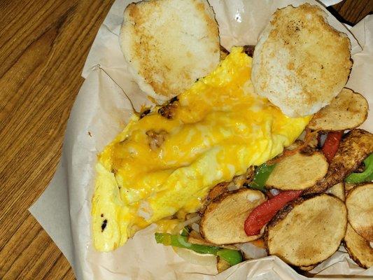 A three egg, 3 item cheese omelet, breakfast potatoes, and bisquit.  Delicious .