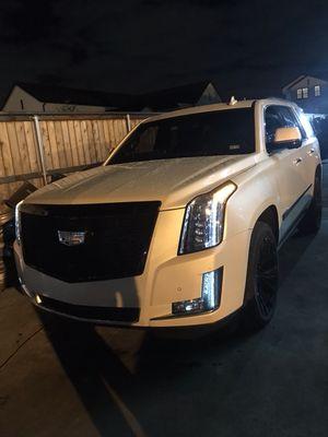 Cadillac Escalade with vogue wheels and tires and grill