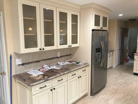 Completed kitchen New Floors, cabinets,granite, light fixtures, back splash  & crown molding.