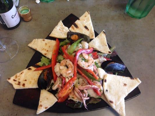 The chilled seafood salad. Shrimp, calamari, scallops, and mussels, with greens, red onions, and red and green peppers