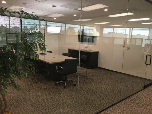 They refinished and created a custom top for the conference room furniture.