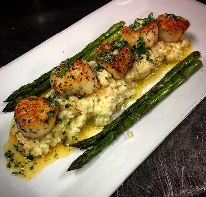 Seared Scallops over a fluffy bed of Risotto and asparagus