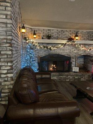 Chill area with sofas and real fireplace