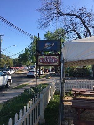 Picture of the Lunar Pizza sign, they're right beside Regal Ravioli and have the same owner too.