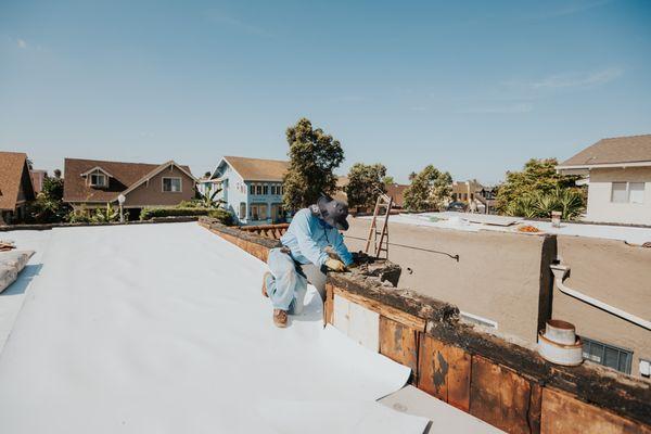 Working on an apartment roof replacement