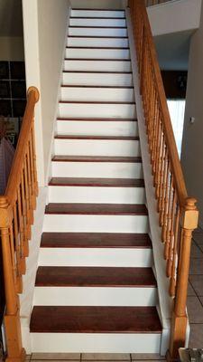 Contrast Dark Laminate Floors with White Risers for a Great look!