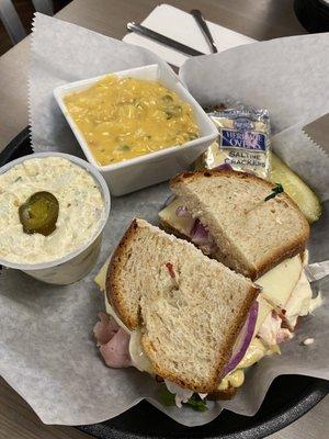 Turkey and ham sandwich on wheat bread, turkey cheddar soup, and jalapeño potato soup