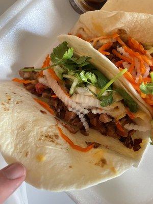 Grilled pork tacos with daikon & carrot slaw. Generous amount of fillings.