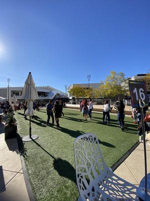 People dancing at the outside turf area