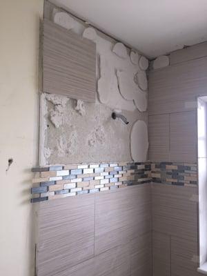 Tiles falling off wall