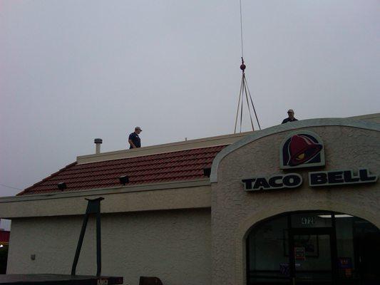 RTU being hoisted from roof with 20 ton crane.