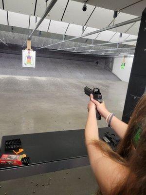 Summer daughter with the SigSauer P320 XFive Legion.