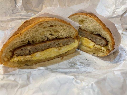 Croissant egg and sausage breakfast sandwich