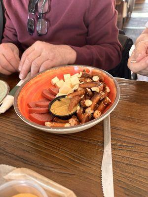 Appetizer with cheese, hard pretzels, bologna and mustard after we dug in!