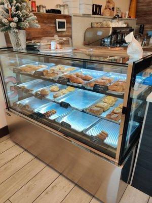 Display case with fresh made in-house pasteles