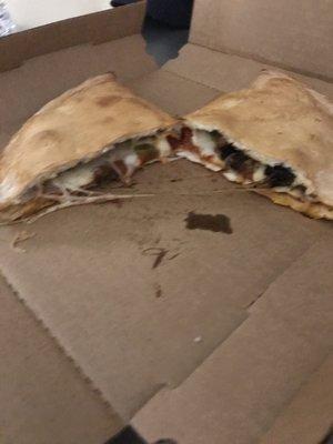 Calzone with sausage, pepperoni, onion and bell peppers