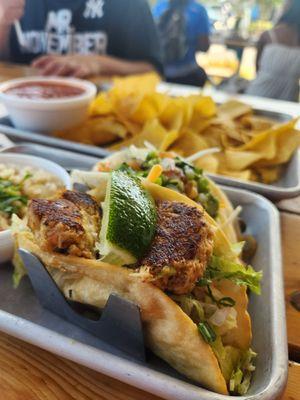 Crab cake and steak tacos with chips and salsa