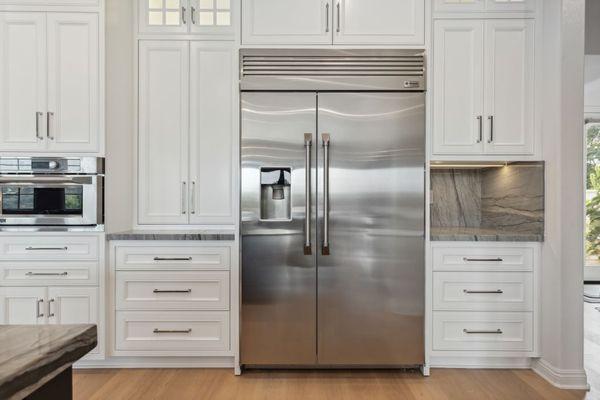 This Classic Kitchen in Rancho Santa Fe features Quartzite countertops, along with premium painted face frame cabinetry inset cabinet doors.