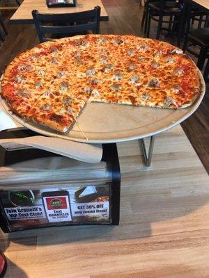 16" Cheese and sausage pizza.