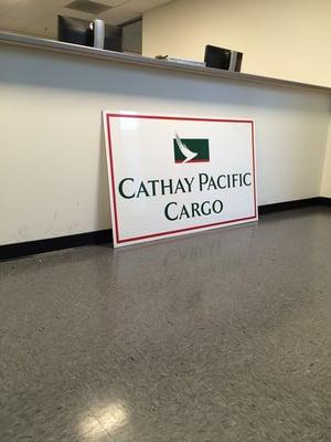 Cathay Pacific Cargo sign waiting to be hung up.