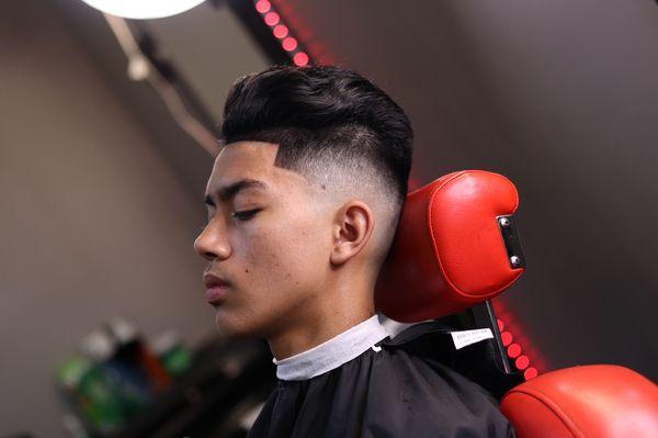 Mid bald fade slick back done by Matty