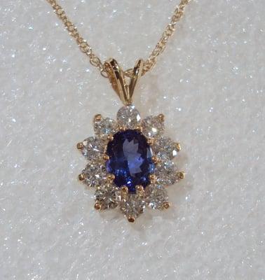 This gorgeous tanzanite and diamond pendant was designed by Jim Green. Each individual stone has been hand selected and set b...