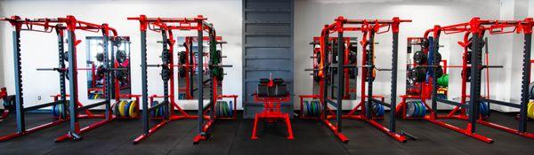 Four squat racks - each with landmine attachments and pull up bars!