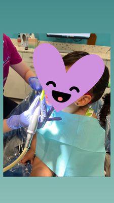 Getting a cleaning by dental hygienist