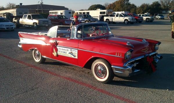 burleson smiles at the december 2012 rotary club christmas parade.  dr. ron hawkins' 1957 chevy prepping for the parade.