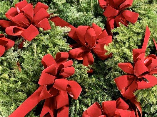 merry, merry! piles of evergreen and ribbon