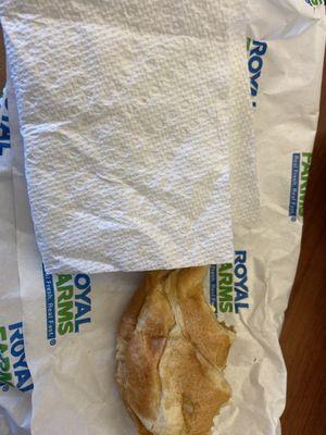 Breakfast sandwich from Royal Farms with piece of hair on the napkin.