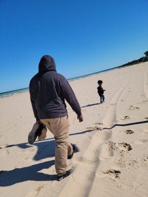 Father son moment at North Beach early in the morning. (It was cold out)